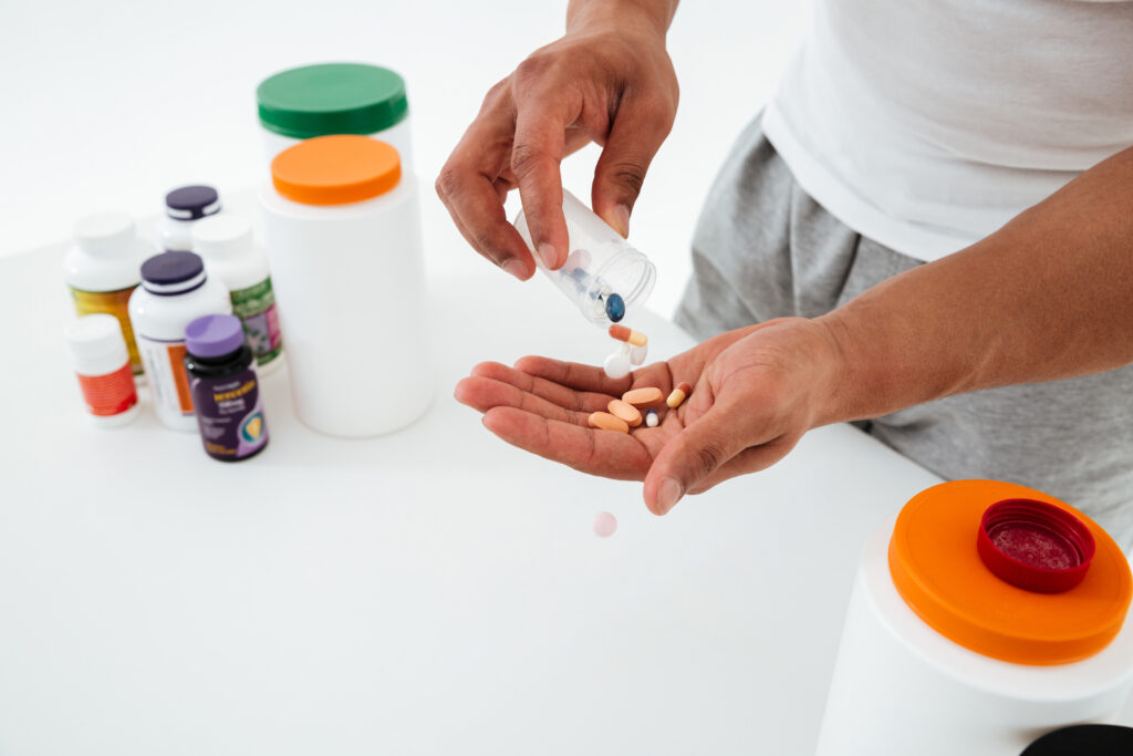 How Do SARMs Compare to Traditional Anabolic Steroids for Muscle Gain and Performance? 1 Athlete holding supplements for muscle gain comparison